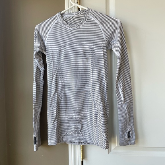 Lululemon long shirt.  The shirts are on the longer side and slim fitting - Picture 2 of 3